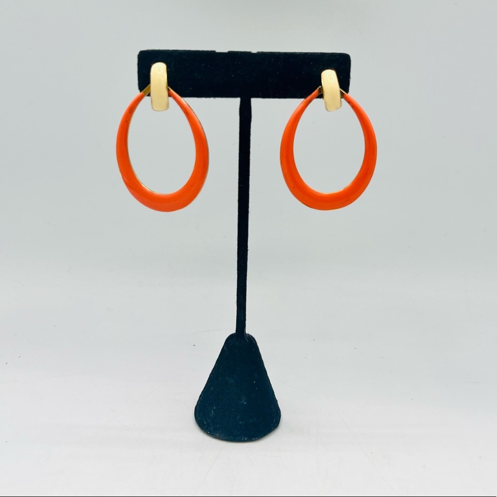 Vintage red-orange and cream enamel clip on gold tone doorknocker earrings
